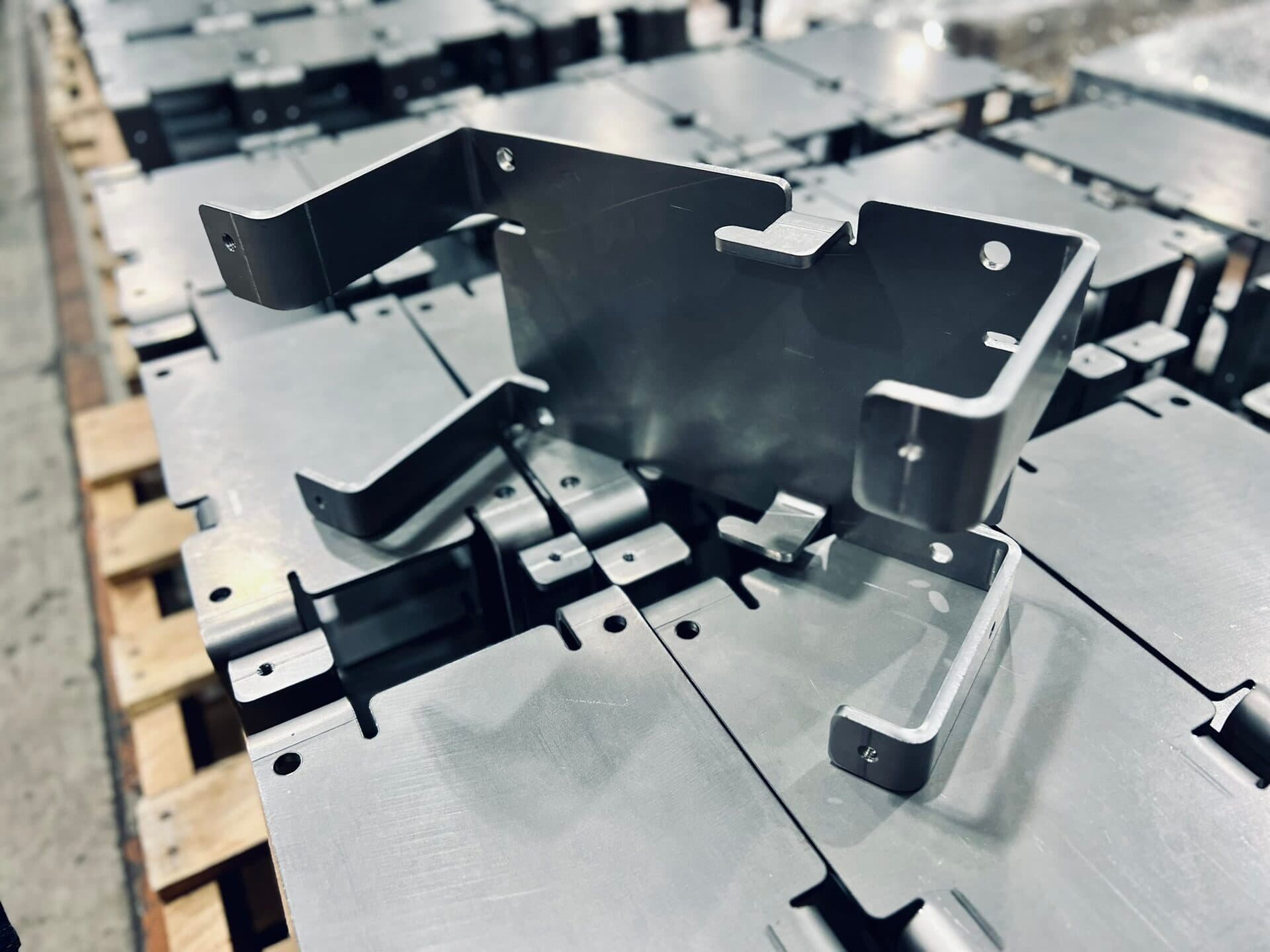 Operator positioning sheet metal inside a Trumpf TruBend press brake